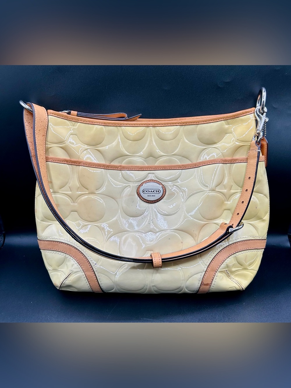 COACH Peyton Signature Embossed Patent Leather Hobo Bag.
